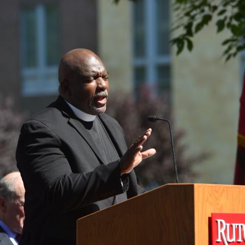 Reverend Jimmie L. Miller speaks at a podium