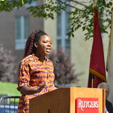 Mahogany Laveau speaks at a podium