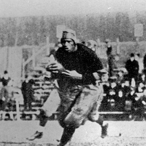 Paul Robeson running on the football field