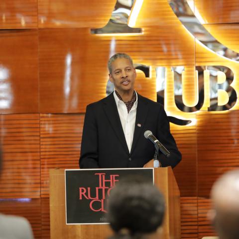 Darren Clarke speaks at a podium