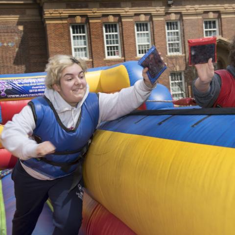 Students race each other on a bungie ride