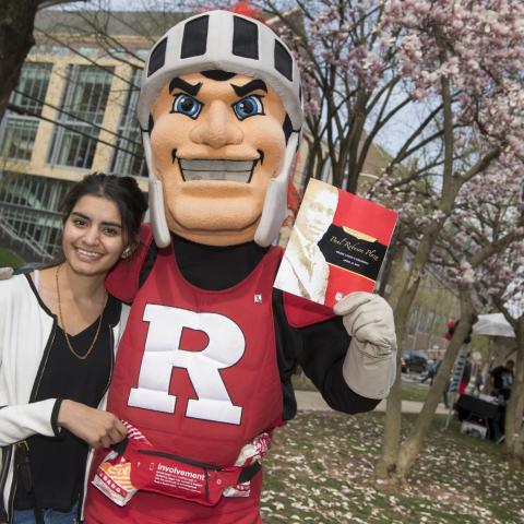 Student poses with the Scarlet Knight at Robeson Fest